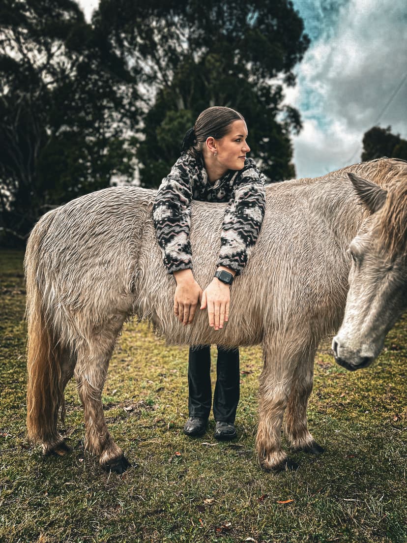 girl hugging horse